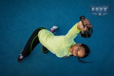Woman exercising with a kettlebell indoors