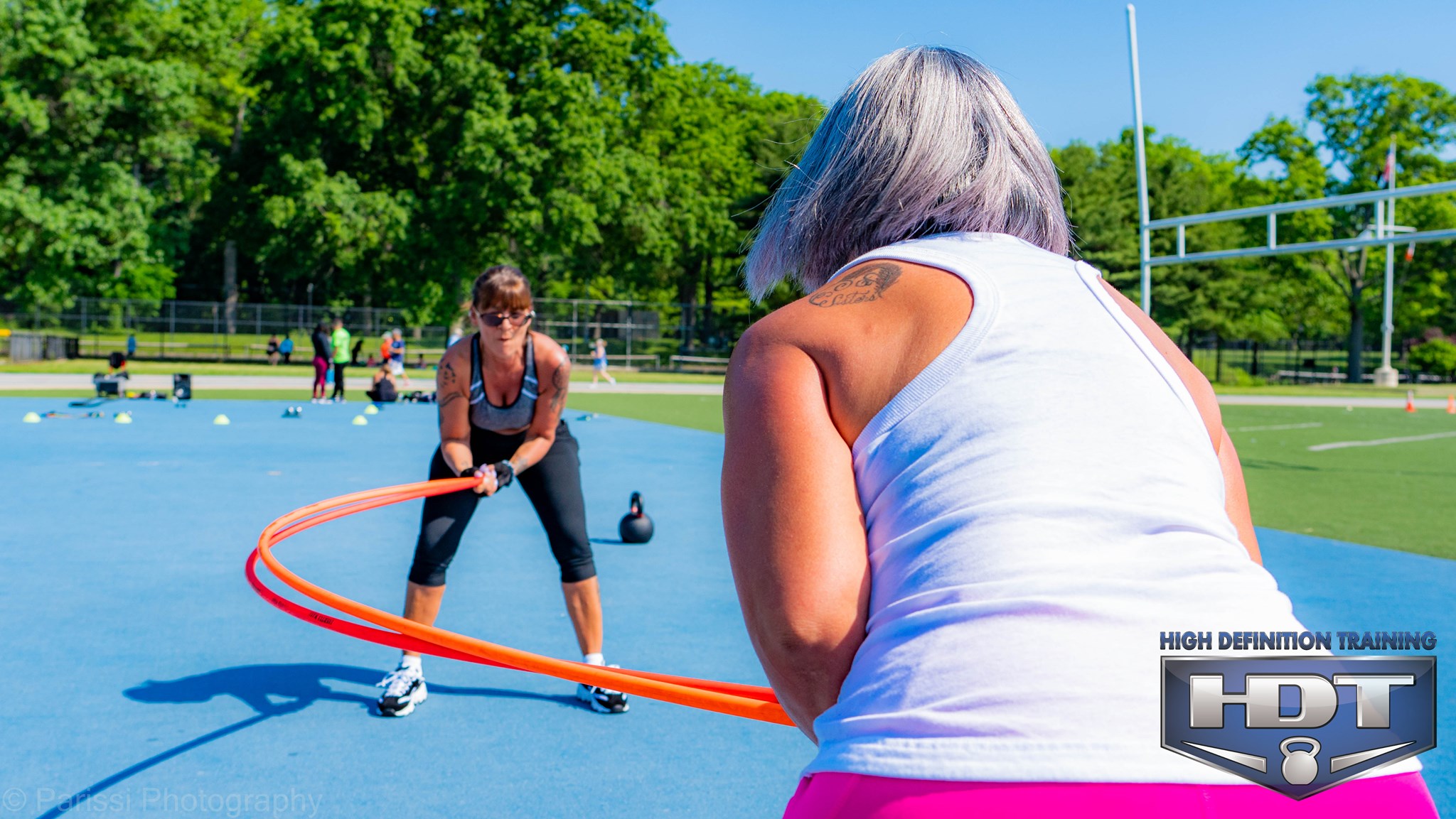 Women exercising with resistance bands outdoors