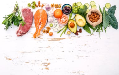 Healthy food spread with meats, fish, vegetables, and nuts